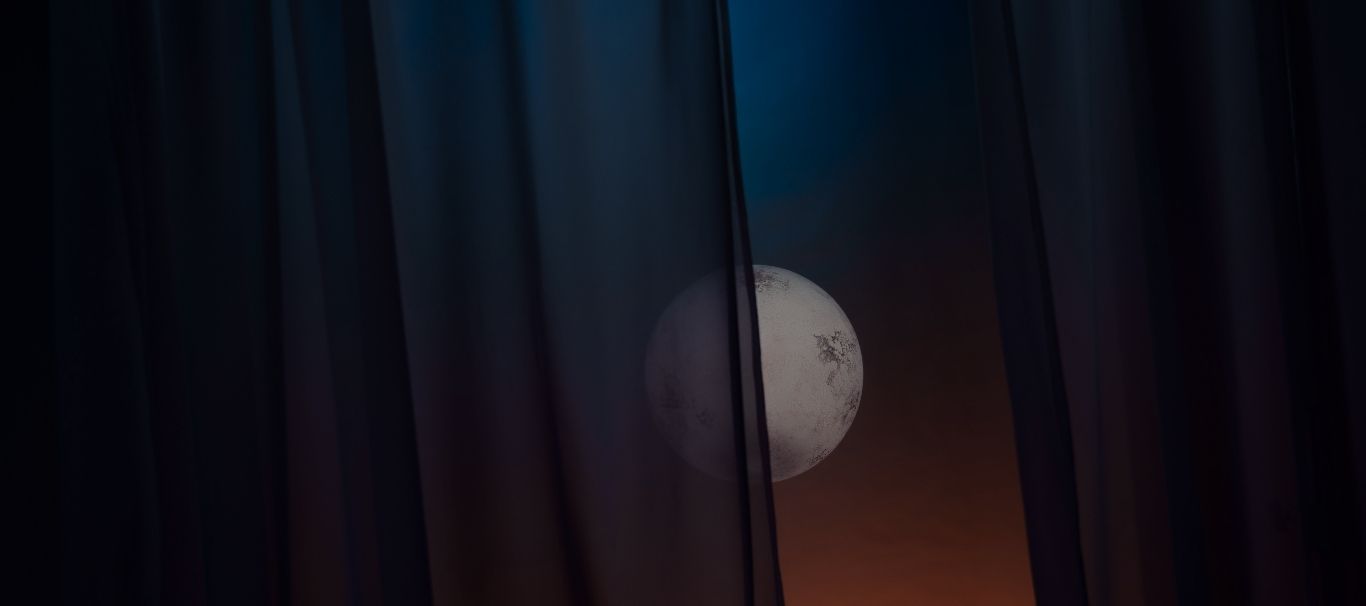 The moon hiding behind a veil